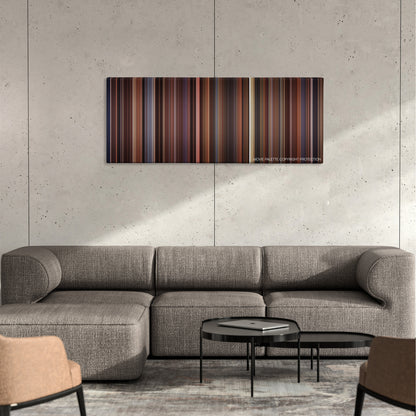 Bicentennial Man color palette canvas on a concrete wall above a gray sectional sofa