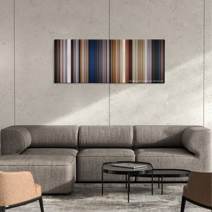 Men in Black: International color palette canvas on a concrete wall above a gray sectional sofa