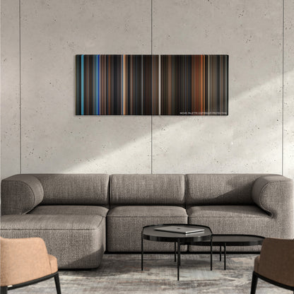 Batman Begins color palette canvas on a concrete wall above a gray sectional sofa