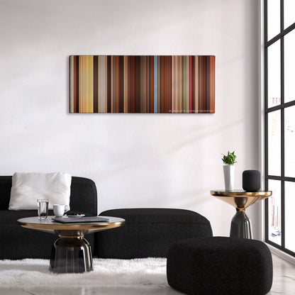 Alexander color palette canvas above a black sofa with a gold-topped table
