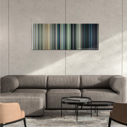 Jurassic World color palette canvas on a concrete wall above a gray sectional sofa
