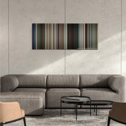Logan color palette canvas on a concrete wall above a gray sectional sofa