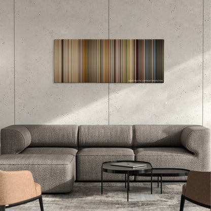 Premium Rush color palette canvas on a concrete wall above a gray sectional sofa