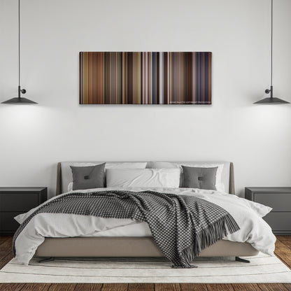 Willow color palette canvas above a bed, between two black pendant lamps