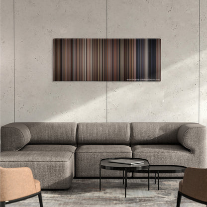 L.A. Confidential color palette canvas on a concrete wall above a gray sectional sofa