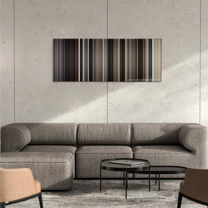 Looper color palette canvas on a concrete wall above a gray sectional sofa