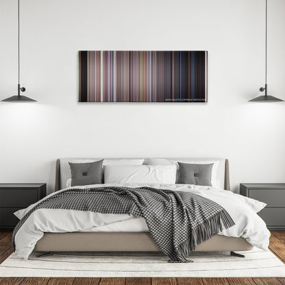 The Faculty color palette canvas above a bed, between two black pendant lamps