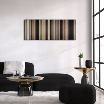 Mud color palette canvas above a black sofa with a gold-topped table