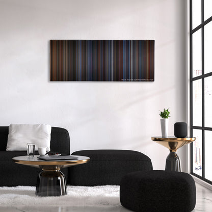 Die Hard color palette canvas above a black sofa with a gold-topped table