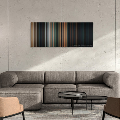 Halloween color palette canvas on a concrete wall above a gray sectional sofa