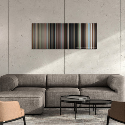 Wild Things color palette canvas on a concrete wall above a gray sectional sofa