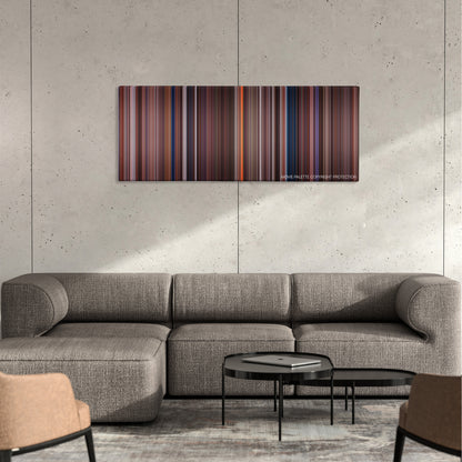 Spy Kids color palette canvas on a concrete wall above a gray sectional sofa