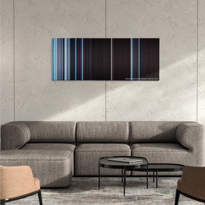 The Hateful Eight color palette canvas on a concrete wall above a gray sectional sofa
