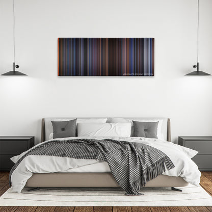 Judge Dredd color palette canvas above a bed, between two black pendant lamps