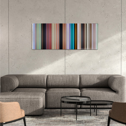 Ice Age color palette canvas on a concrete wall above a gray sectional sofa