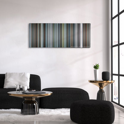 Burnt color palette canvas above a black sofa with a gold-topped table