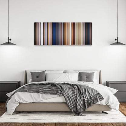 Men in Black: International color palette canvas above a bed, between two black pendant lamps