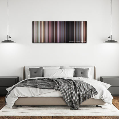 The Whole Nine Yards color palette canvas above a bed, between two black pendant lamps