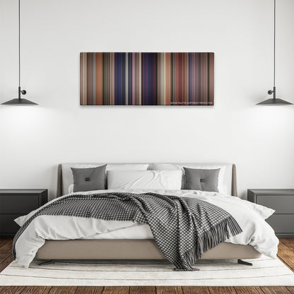 The Nutty Professor color palette canvas above a bed, between two black pendant lamps