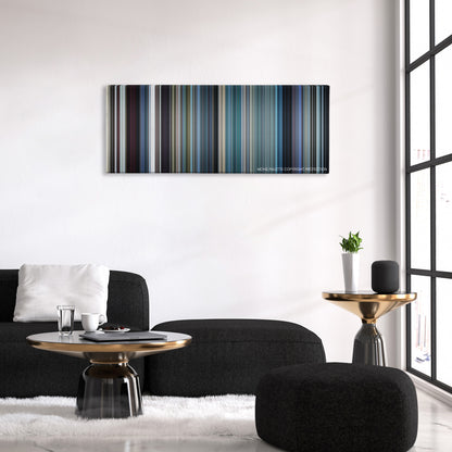 The French Connection color palette canvas above a black sofa with a gold-topped table
