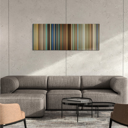 Lucy color palette canvas on a concrete wall above a gray sectional sofa