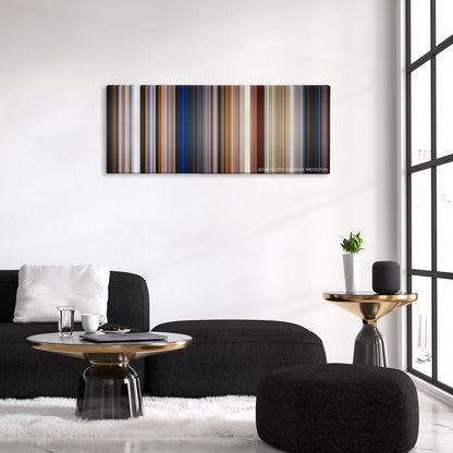 Men in Black: International color palette canvas above a black sofa with a gold-topped table
