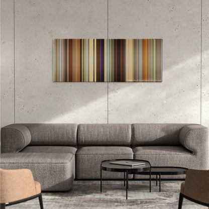 American Hustle color palette canvas on a concrete wall above a gray sectional sofa