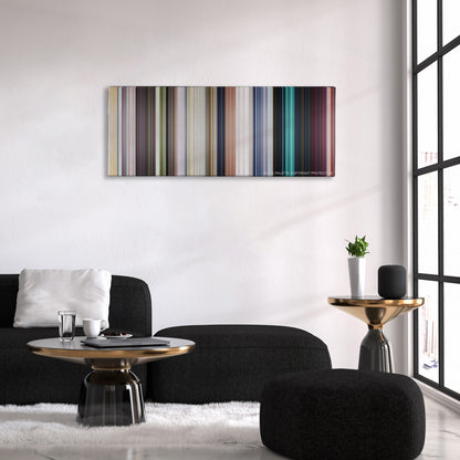 Central Intelligence color palette canvas above a black sofa with a gold-topped table