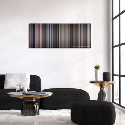 Serpico color palette canvas above a black sofa with a gold-topped table