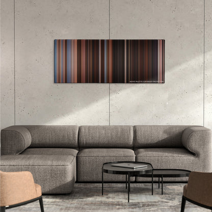 Horrible Bosses color palette canvas on a concrete wall above a gray sectional sofa