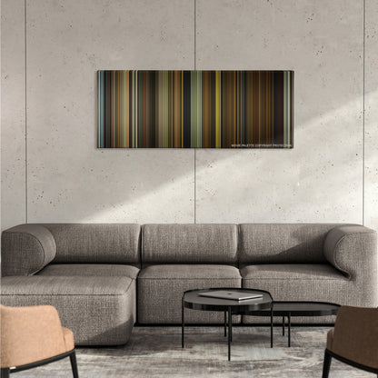 Split color palette canvas on a concrete wall above a gray sectional sofa