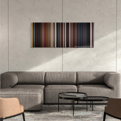 The Wolverine color palette canvas on a concrete wall above a gray sectional sofa