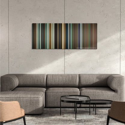 Warrior color palette canvas on a concrete wall above a gray sectional sofa