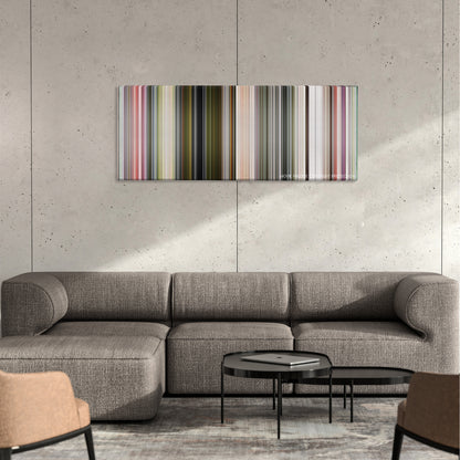 The Two Popes color palette canvas on a concrete wall above a gray sectional sofa