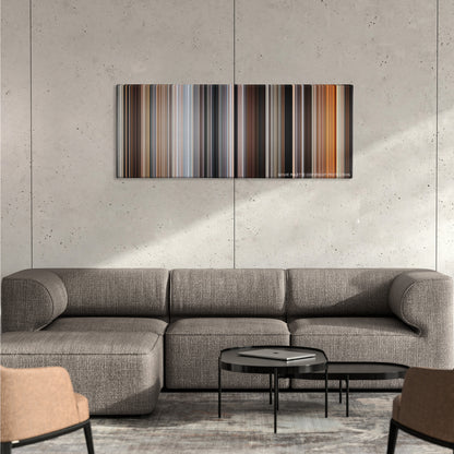 Quantum of Solace color palette canvas on a concrete wall above a gray sectional sofa