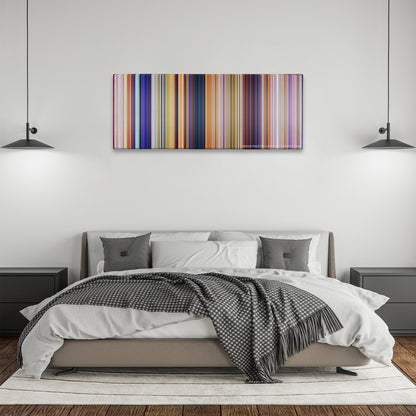 The Lorax color palette canvas above a bed, between two black pendant lamps