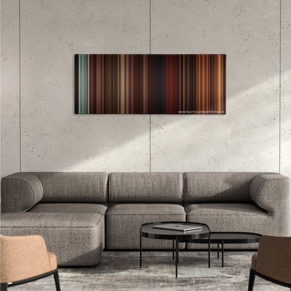 Gangs of New York color palette canvas on a concrete wall above a gray sectional sofa