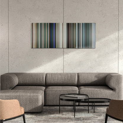 Elysium color palette canvas on a concrete wall above a gray sectional sofa