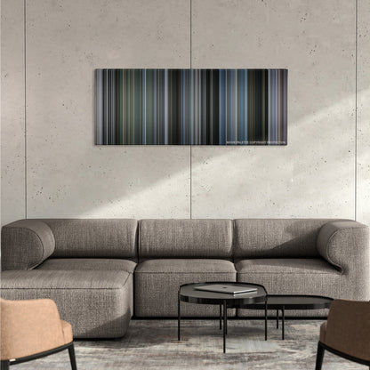 Mystic River color palette canvas on a concrete wall above a gray sectional sofa