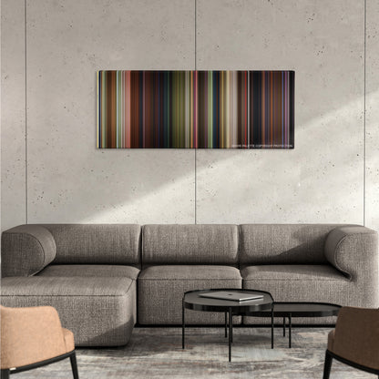 Shrek 2 color palette canvas on a concrete wall above a gray sectional sofa