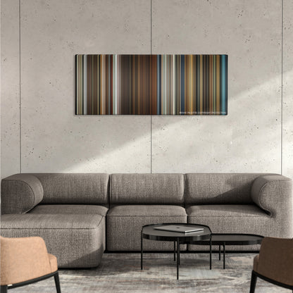 In Bruges color palette canvas on a concrete wall above a gray sectional sofa