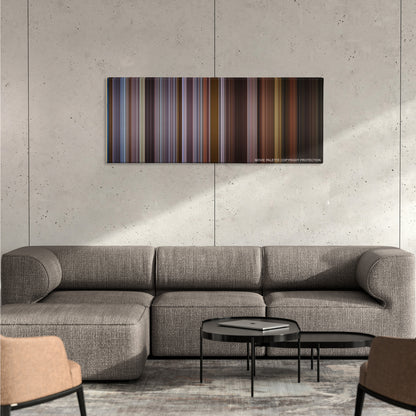 Training Day color palette canvas on a concrete wall above a gray sectional sofa