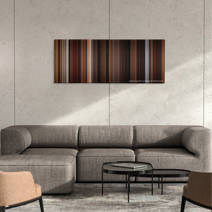 Sex Tape color palette canvas on a concrete wall above a gray sectional sofa
