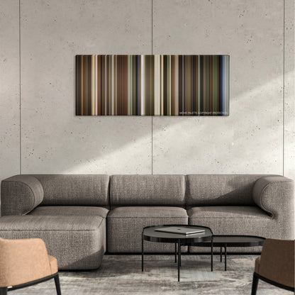 Pirate Radio color palette canvas on a concrete wall above a gray sectional sofa