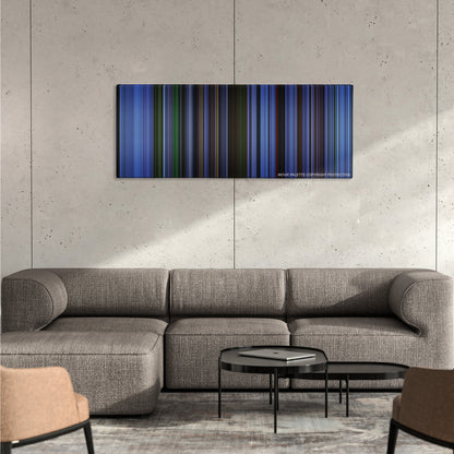 Saw color palette canvas on a concrete wall above a gray sectional sofa