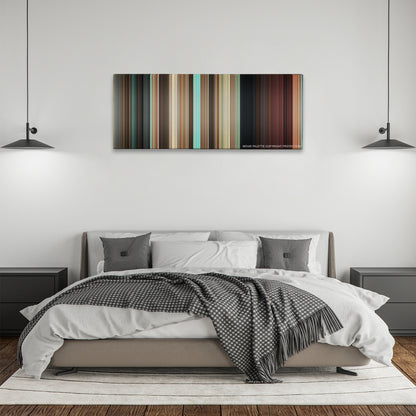 Couples Retreat color palette canvas above a bed, between two black pendant lamps