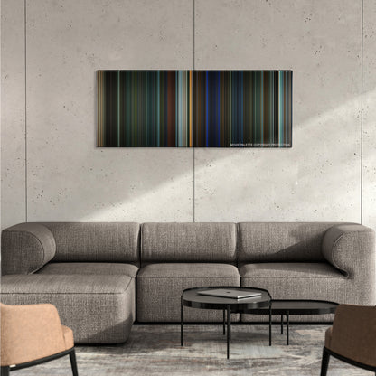 Collateral color palette canvas on a concrete wall above a gray sectional sofa