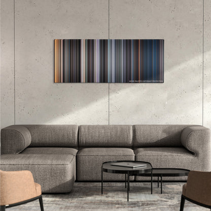 The Exorcist color palette canvas on a concrete wall above a gray sectional sofa