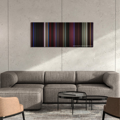 Only God Forgives color palette canvas on a concrete wall above a gray sectional sofa