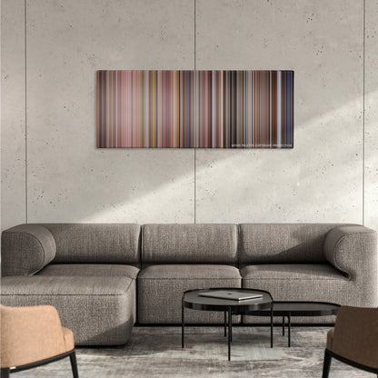 Die Hard with a Vengeance color palette canvas on a concrete wall above a gray sectional sofa